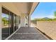 Covered patio with brick pavers and sliding glass doors at 17376 W Wildwood St, Surprise, AZ 85388