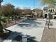 Community basketball court surrounded by residential homes, trees, and a covered picnic area at 17802 N 114Th Ln, Surprise, AZ 85378