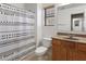 Functional bathroom with a shower-tub combination, single vanity, and modern fixtures for everyday use at 17802 N 114Th Ln, Surprise, AZ 85378
