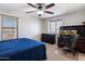 Spacious bedroom featuring large windows and a ceiling fan, providing ample natural light and ventilation at 17802 N 114Th Ln, Surprise, AZ 85378