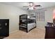 Cozy bedroom featuring bunk beds and a neutral color scheme, ideal for children or guests at 17802 N 114Th Ln, Surprise, AZ 85378