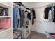 Walk-in closet offers ample storage space with built-in shelving and hanging rods for organization at 17802 N 114Th Ln, Surprise, AZ 85378