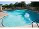Sparkling community pool with ample seating and a meticulously maintained deck for residents' enjoyment at 17802 N 114Th Ln, Surprise, AZ 85378