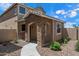 Charming two-story home featuring a beautiful stone facade, landscaped yard, and inviting walkway at 17802 N 114Th Ln, Surprise, AZ 85378