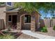 Charming home with a stone facade, inviting walkway, and lovely landscaping at 17802 N 114Th Ln, Surprise, AZ 85378