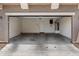 Spacious and clean empty garage with ample room for parking and storage, plus an adjacent utility closet at 17802 N 114Th Ln, Surprise, AZ 85378