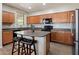 Well-equipped kitchen with modern appliances, ample counter space, and a central island at 17802 N 114Th Ln, Surprise, AZ 85378
