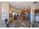 Inviting breakfast nook offering views of the kitchen and backyard at 1809 E Adelante Way, Queen Creek, AZ 85140