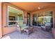 Outdoor seating area with wicker furniture and a view of the large sliding glass doors at 1809 E Adelante Way, Queen Creek, AZ 85140