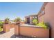 Inviting home entrance with a brick pathway and manicured plants and desert landscaping at 1809 E Adelante Way, Queen Creek, AZ 85140