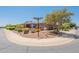 Corner lot home with desert landscaping and a view of the home's covered front entrance at 1809 E Adelante Way, Queen Creek, AZ 85140