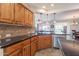 Kitchen with stainless steel appliances, dark countertops, and open concept design at 1809 E Adelante Way, Queen Creek, AZ 85140