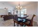 Open-concept living area with seamless flooring and views of the backyard at 1809 E Adelante Way, Queen Creek, AZ 85140