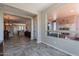 Open living area featuring tile flooring, seamless flow to the kitchen, and backyard view at 1809 E Adelante Way, Queen Creek, AZ 85140