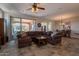 Spacious living room with tile floors, large windows and open concept design at 1809 E Adelante Way, Queen Creek, AZ 85140