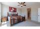 Inviting main bedroom with neutral walls, carpeted floor, and warm decorative accents at 1809 E Adelante Way, Queen Creek, AZ 85140