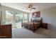 Serene main bedroom with large windows and a comfortable four-poster bed at 1809 E Adelante Way, Queen Creek, AZ 85140