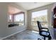 Bright home office featuring ample natural light and backyard views at 1809 E Adelante Way, Queen Creek, AZ 85140