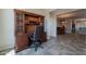 Spacious home office with a built-in desk, hutch, and seamless flooring at 1809 E Adelante Way, Queen Creek, AZ 85140