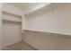 Walk-in closet featuring installed shelving for maximum storage and organization at 1809 E Adelante Way, Queen Creek, AZ 85140