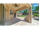 Covered back patio with a ceiling fan, stamped concrete, and a view of the landscaped backyard at 2031 W Periwinkle Way, Chandler, AZ 85248