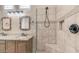 Modern bathroom featuring a tiled shower with bench and dual sinks with granite countertops at 2031 W Periwinkle Way, Chandler, AZ 85248