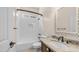 Bathroom featuring subway tile shower/bath combo, granite counters and modern fixtures at 2031 W Periwinkle Way, Chandler, AZ 85248