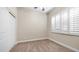 Inviting bedroom with plantation shutters and ample natural light at 2031 W Periwinkle Way, Chandler, AZ 85248