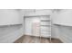 Walk-in closet with built-in shelving and drawers providing ample storage at 2031 W Periwinkle Way, Chandler, AZ 85248