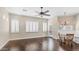 Open-concept dining area with hardwood floors, plantation shutters, and ample natural light at 2031 W Periwinkle Way, Chandler, AZ 85248