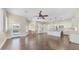 A full living space connecting the kitchen to the breakfast nook with hardwood floors at 2031 W Periwinkle Way, Chandler, AZ 85248