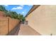 Property side yard with block fencing and pavers. A/C Unit at 2031 W Periwinkle Way, Chandler, AZ 85248