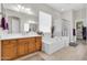 Bathroom with tub, shower, and double sink vanity, offering comfort and convenience at 20423 S 186Th St, Queen Creek, AZ 85142