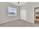 Neutral bedroom features carpeted floors, a window, and a double-door closet at 20423 S 186Th St, Queen Creek, AZ 85142