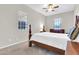 Bedroom featuring carpeted floors, a window, and a wooden bed frame at 20423 S 186Th St, Queen Creek, AZ 85142