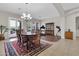The formal dining room is furnished with a large wooden table, elegant chairs, and a stylish chandelier at 20423 S 186Th St, Queen Creek, AZ 85142