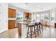 Open kitchen offers a large island, modern appliances, and an adjacent dining area at 20423 S 186Th St, Queen Creek, AZ 85142