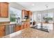 Beautiful kitchen equipped with stainless appliances, granite countertops, and a view to the outdoors at 20423 S 186Th St, Queen Creek, AZ 85142