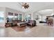 A spacious living room is furnished with comfortable couches, a wood-framed coffee table, and stylish lighting at 20423 S 186Th St, Queen Creek, AZ 85142