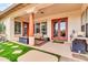 Outdoor patio with artificial turf, seating, grill, and access to the house at 20423 S 186Th St, Queen Creek, AZ 85142