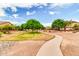 Scenic community walking path surrounded by lush landscaping, providing a serene outdoor experience at 20423 S 186Th St, Queen Creek, AZ 85142