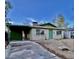 Single-story home features a carport, neutral brick, and a compact front yard for easy maintenance at 2134 E Harvard St, Phoenix, AZ 85006