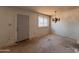 Bright living room with a door and hanging chandelier at 2134 E Harvard St, Phoenix, AZ 85006