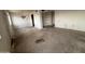 Open living room showcasing a vintage chandelier and built in shelving at 2134 E Harvard St, Phoenix, AZ 85006