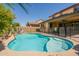 Backyard pool with safety fence offers a great space for recreation at 22184 N 101St Dr, Peoria, AZ 85383