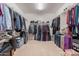Spacious walk-in closet with ample storage space and organized shelving for clothes and belongings at 22184 N 101St Dr, Peoria, AZ 85383