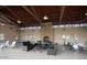 Community clubhouse with a cozy fireplace, comfortable seating, and tables for gatherings at 22184 N 101St Dr, Peoria, AZ 85383