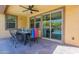Outdoor covered patio shows a pool and dining, perfect for entertaining at 22184 N 101St Dr, Peoria, AZ 85383