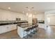 A kitchen featuring a large island with seating, stainless steel appliances, and ample counter space at 22184 N 101St Dr, Peoria, AZ 85383
