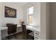 Bright office nook with built-in desk, natural light, and modern decor at 22184 N 101St Dr, Peoria, AZ 85383